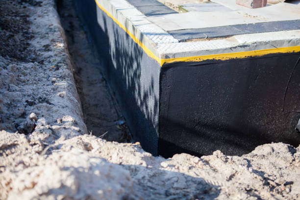 Professional Basement Waterproofing technician working in Fairfax, MN